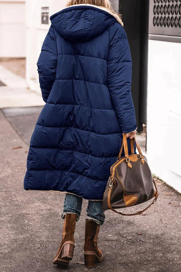 Long quilted jacket with a shearling lining and a hood