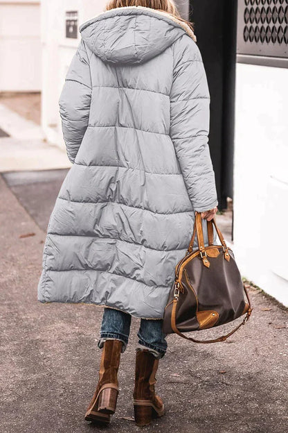 Long quilted jacket with a shearling lining and a hood