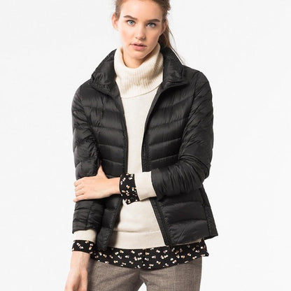 Light quilted jacket in navy blue with a high collar